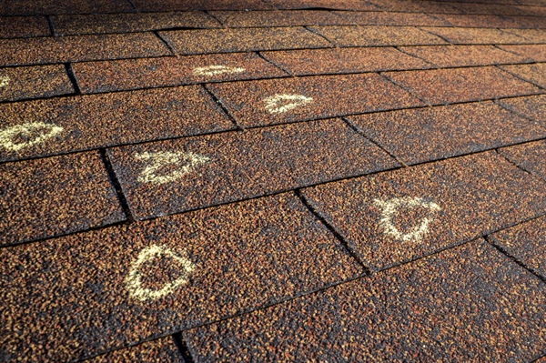 Navigating Roof Insurance Claims After Hail or Wind Damage